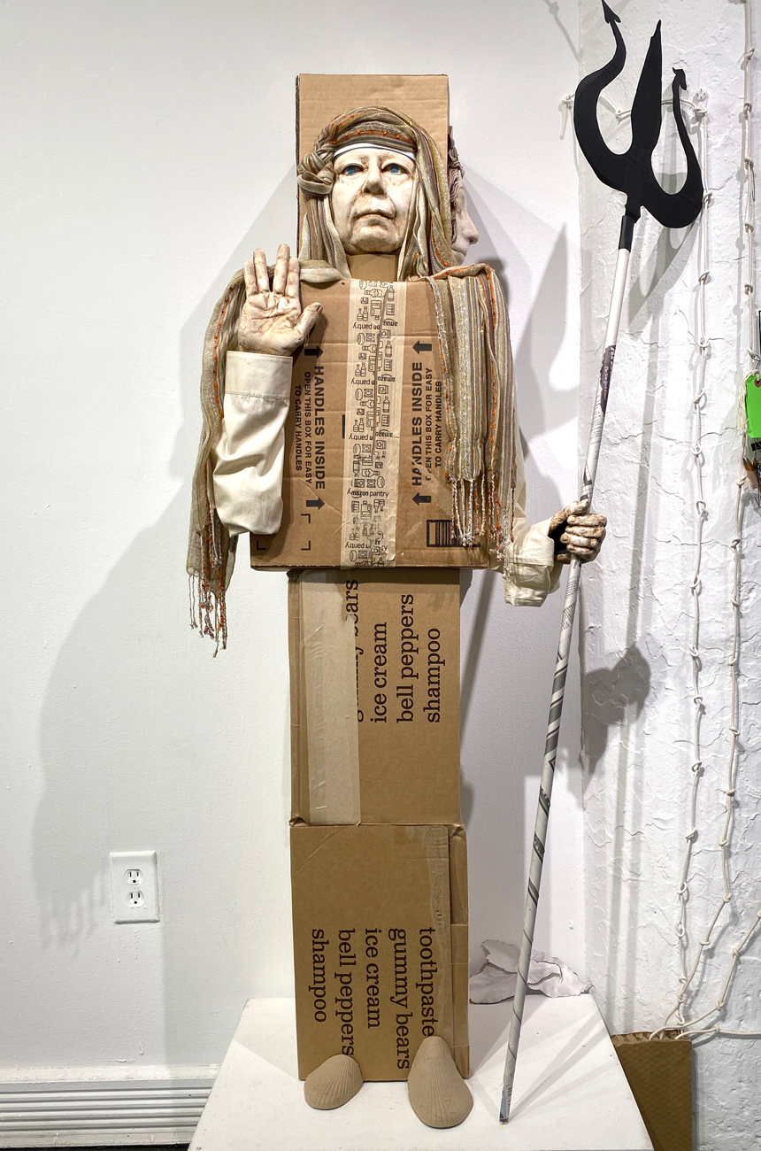 A statue of a person holding a cross

Description automatically generated with medium confidence