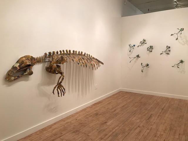 Christy Rupp, room intallation: (left) Manatee Skeleton, 2015, welded steel credit solicitations, mixed media, 43x122x17in, (back) Swiped, 2015, welded steel and green credit cards, 8x9x5in