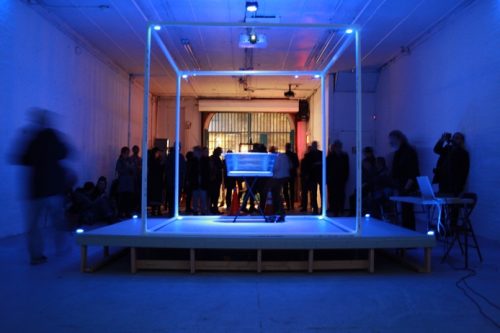 A group of people in a room Description automatically generated