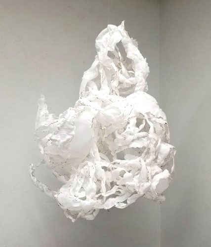 A picture containing wall, sitting, white, indoor Description automatically generated