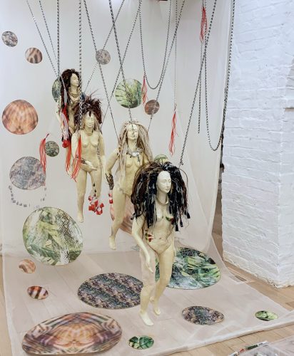 A group of people in a room Description automatically generated