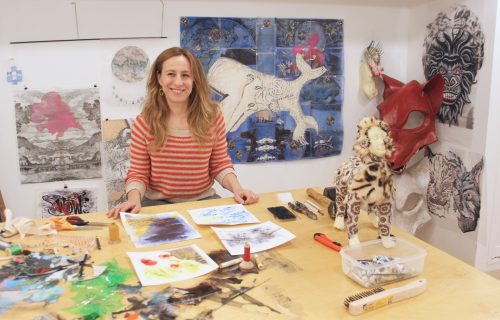 A person sitting at a table Description automatically generated