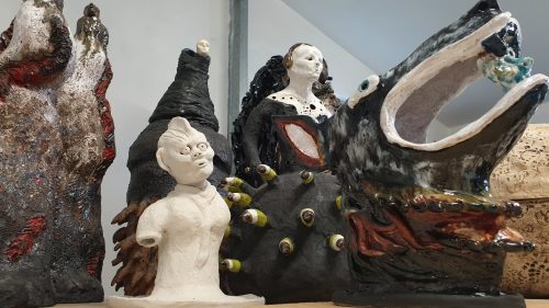 A picture containing cake, sitting, different, table Description automatically generated