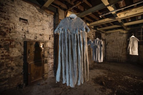 A picture containing building, indoor, sitting, room Description automatically generated