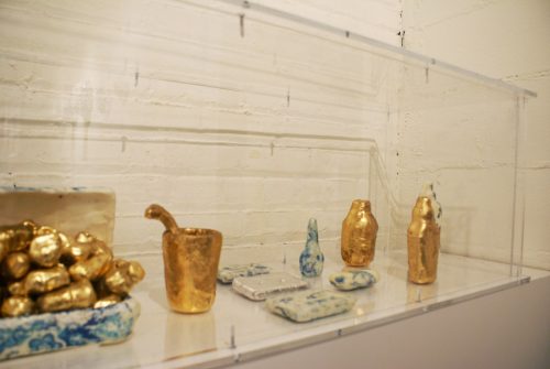 A picture containing indoor, table, counter, sitting Description automatically generated