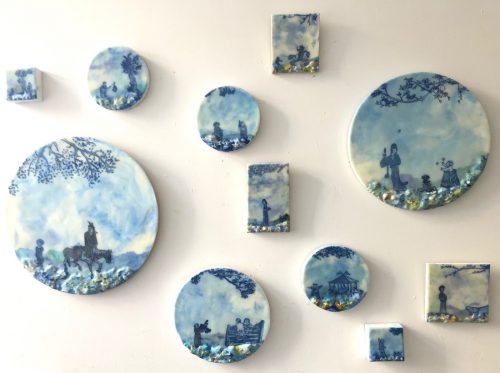 A picture containing photo, white, covered, sitting Description automatically generated