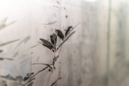 A picture containing vase, plant, indoor, sitting Description automatically generated