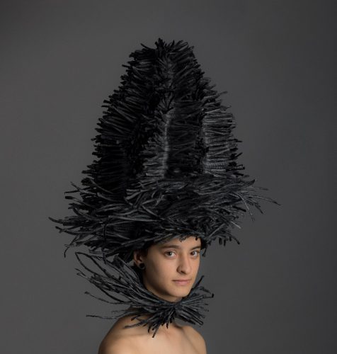 A person wearing a costume Description automatically generated