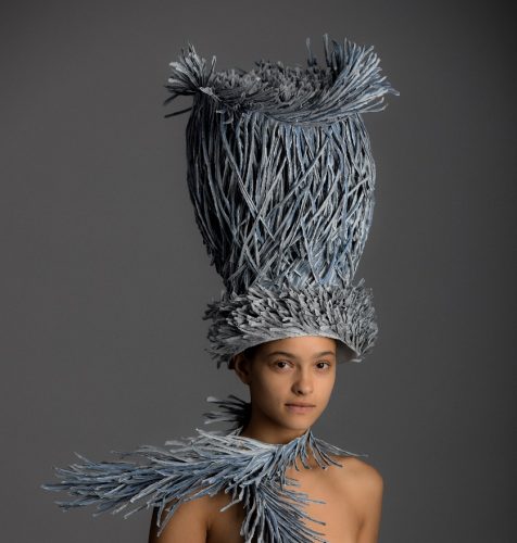 A statue of a person wearing a hat Description automatically generated