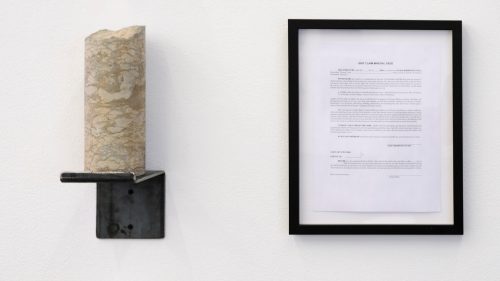 A painting in a frame hanging on a wall Description automatically generated