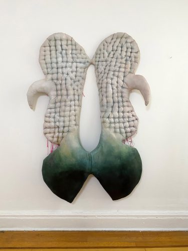 A picture containing indoor, sitting, small, green Description automatically generated