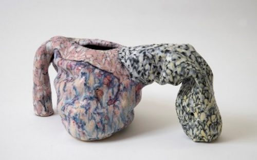 A picture containing indoor, vase, sitting, table Description automatically generated