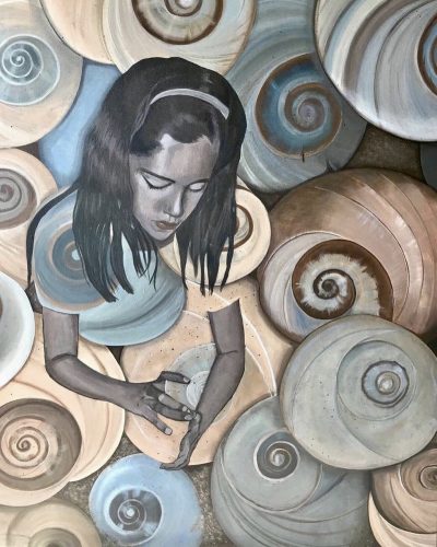 A picture containing wheel, plate, sitting, old Description automatically generated