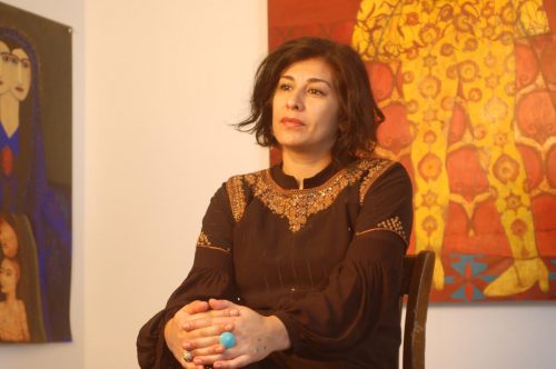 A person sitting in a chair Description automatically generated with medium confidence