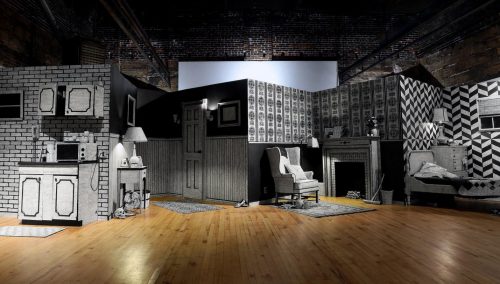 A picture containing text, indoor, floor, living Description automatically generated