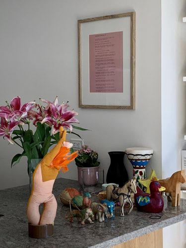 A picture containing wall, indoor, flower, plant Description automatically generated