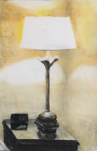 A lamp on a table Description automatically generated with low confidence