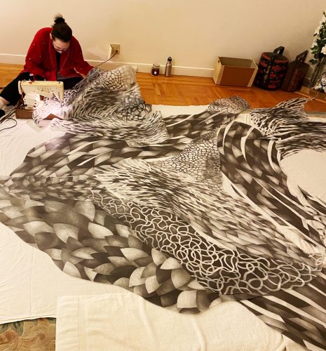 A picture containing indoor, wall, bedclothes Description automatically generated