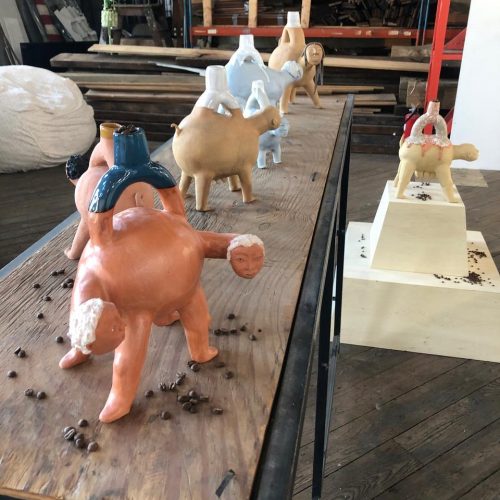 A picture containing indoor, wooden, mammal Description automatically generated