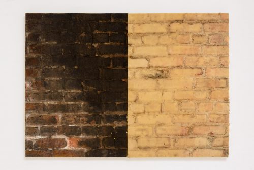 A brick wall with a hole in it Description automatically generated with low confidence