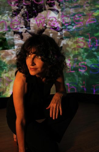 A person in a black dress Description automatically generated with low confidence