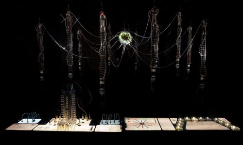 A picture containing text, lit, dark Description automatically generated