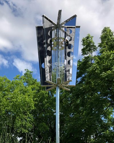 A picture containing text, tree, sky, outdoor Description automatically generated