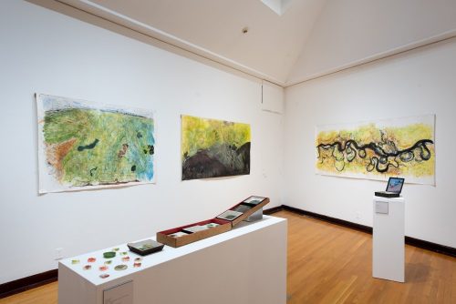 A room with paintings on the wall Description automatically generated with low confidence