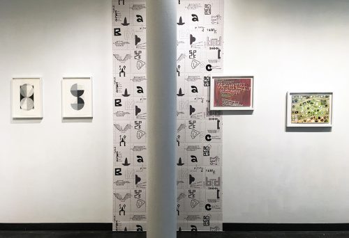 A picture containing text, scene, wall, room Description automatically generated