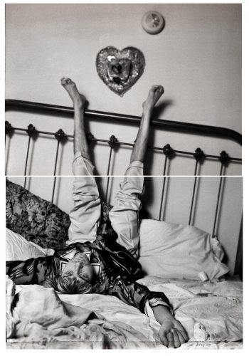 A picture containing text, wall, indoor, bed Description automatically generated