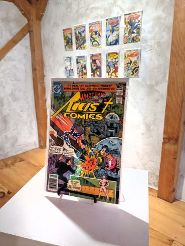 A picture containing text, indoor, gallery Description automatically generated