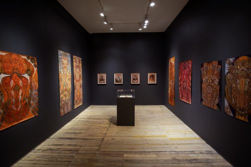 A room with art on the walls Description automatically generated with low confidence