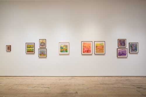 A wall with pictures on it Description automatically generated with medium confidence