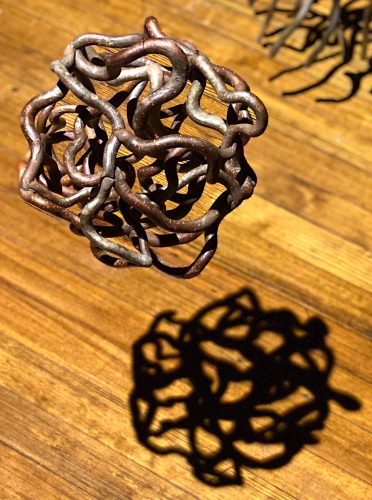 A picture containing metalware, floor, chain, wooden Description automatically generated