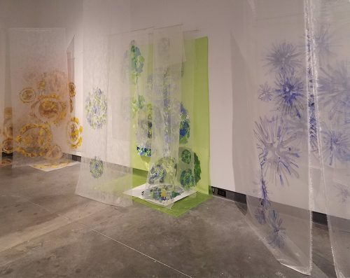 A room with art on the walls Description automatically generated with low confidence