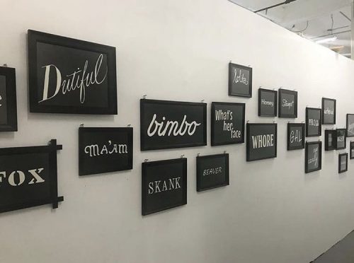 A picture containing text, wall, indoor, scene Description automatically generated