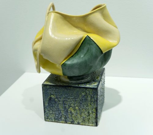 A picture containing yellow, flower, square Description automatically generated