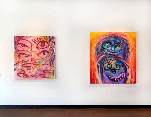 A couple of paintings on a wall Description automatically generated with low confidence