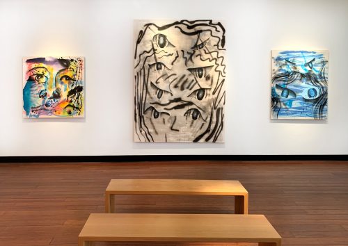 A group of paintings on a wall Description automatically generated with medium confidence