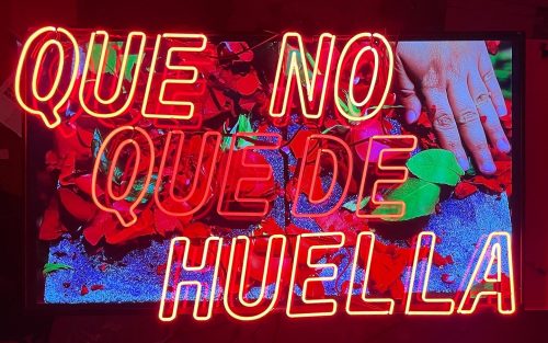 A picture containing text, graffiti, painted, shop Description automatically generated