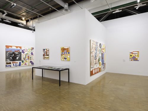 A room with art on the wall Description automatically generated with low confidence