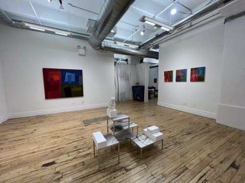 A room with art on the walls Description automatically generated with low confidence