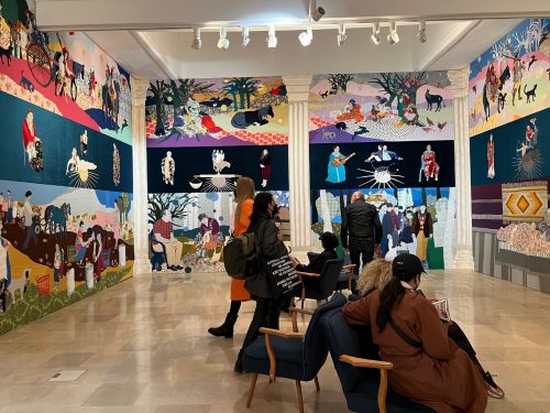 A picture containing text, person, scene, ceiling Description automatically generated