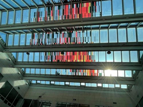 A picture containing text, library, scene, room Description automatically generated