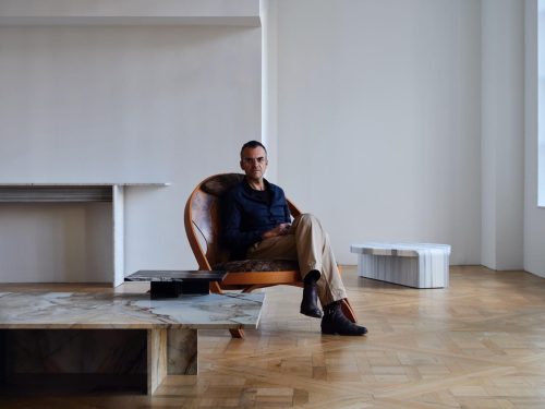 A person sitting in a chair Description automatically generated