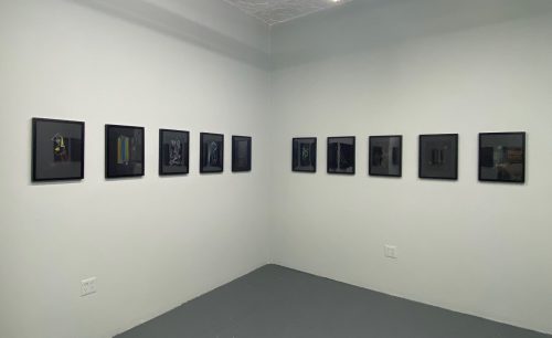 A wall with pictures on it Description automatically generated with medium confidence