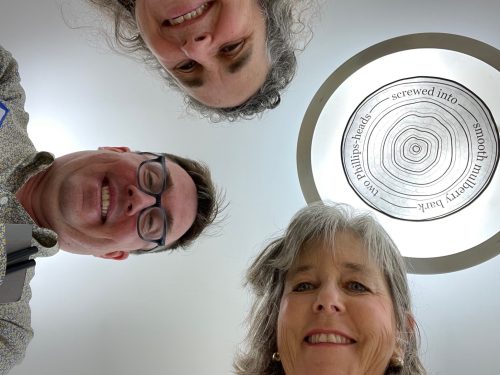 A group of people looking up at the camera Description automatically generated with medium confidence