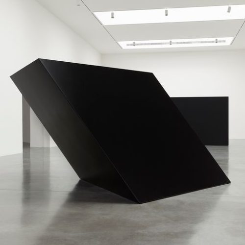 A black rectangular object in a room Description automatically generated