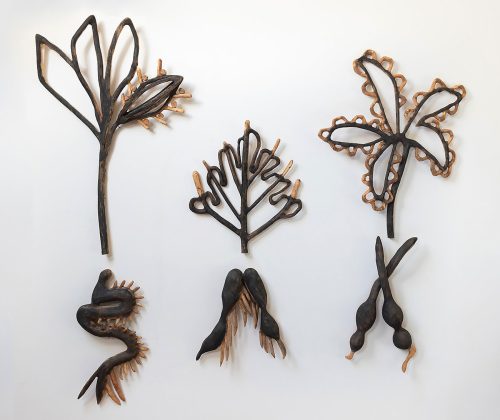 A group of objects made out of wood Description automatically generated
