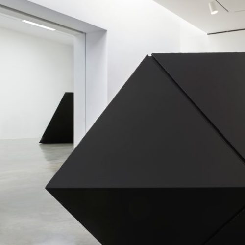 A large black cubes in a room Description automatically generated